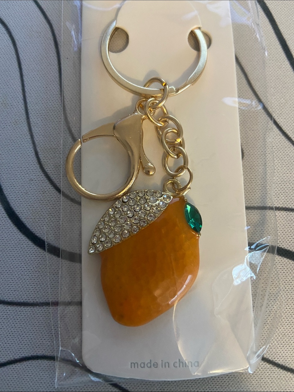 Gold-Tone Yellow Mango Keychain with Green Crystal Accent